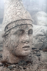Fototapeta premium Ancient ruined statue of King Antiochus I Theos on the top of Nemrut mount, Anatolia, Turkey