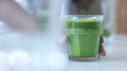 glass with a mathca tee closeup of glass with matcha