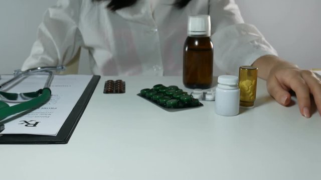 woman doctor demonstrating medication