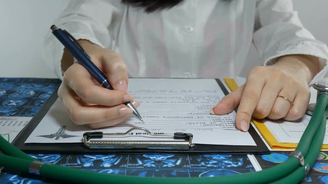 woman doctor prescribes prescription