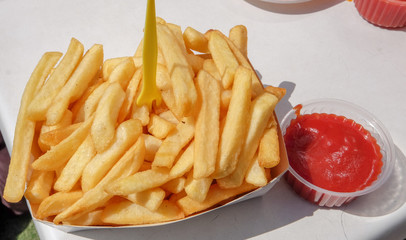 Package of fries with sauces