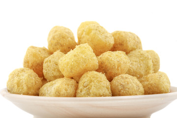 Tasty Round Shaped Yellow Snack Also Know as puffs, puffy Isolated on White Background