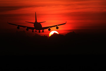 Fototapeta na wymiar Airplane with beautiful sky at sunset on background