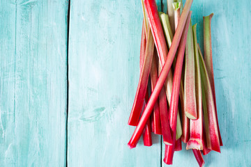 rhubarb stems on wooden surface