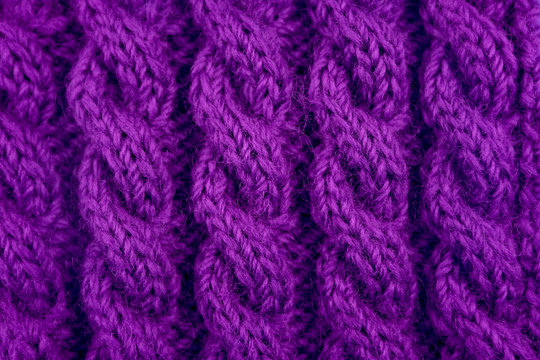 Detail of purple cable knitting stitch