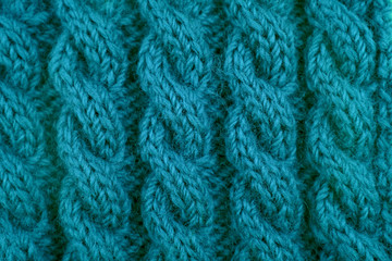 Detail of teal cable knitting stitch