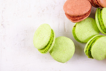 Fresh colored macaroons on wood desk
