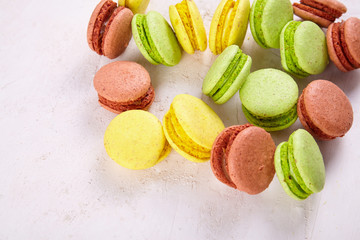 Fresh colored macaroons on wood desk