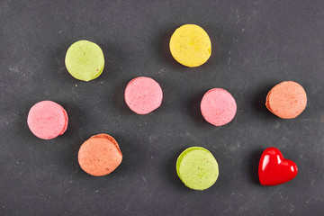 Fresh colored macaroons on wood desk