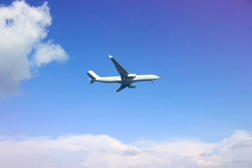 Naklejka na ściany i meble Airplane with beautiful sky on background