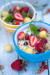 raw oatmeal flakes with berries
