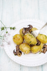 potato with mushrooms on a plate
