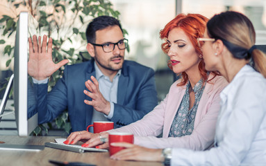 Three business professionals working together