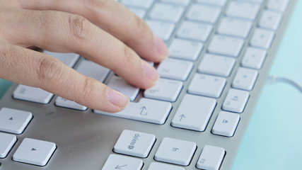Female hands or woman office worker typing on the keyboard