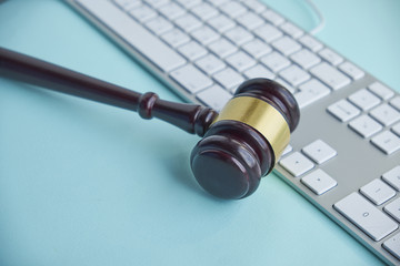 Judge hammer on laptop computer
