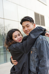 Happy couple embracing and smiling 