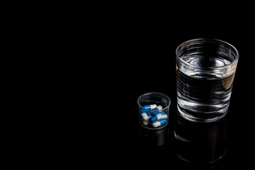Medical pills isolated on a black background