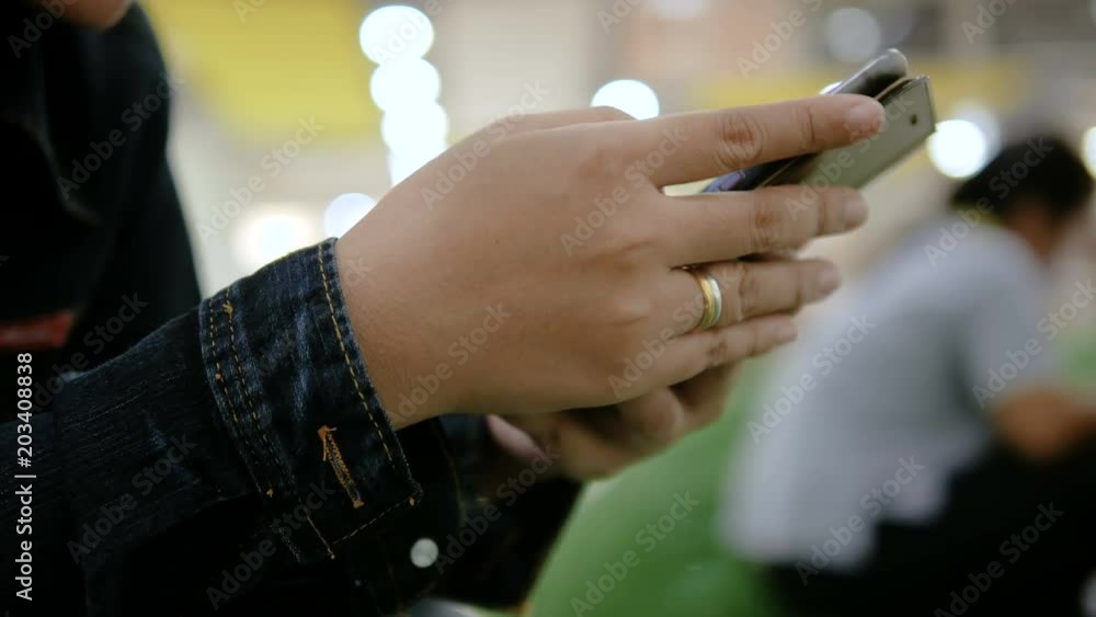 Poster hands of woman using smartphone select focus shallow depth of field