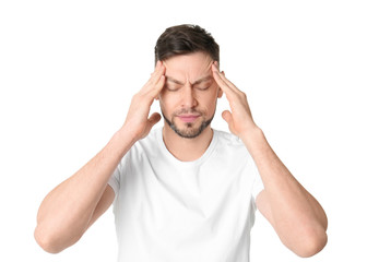 Man suffering from headache on white background