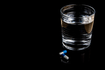 Medical pills isolated on a black background