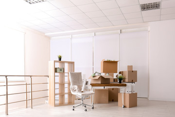 Carton boxes with stuff in room. Office move concept
