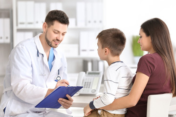Fototapeta premium Woman with her son at doctor's office