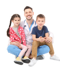 Children's doctor with little kids on white background