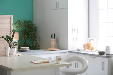 Fototapeta na wymiar Stylish kitchen interior setting. Idea for home design