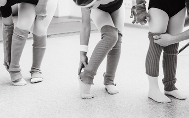 girls dancers classroom adjust clothes legs together