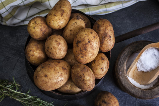 New potatoes on dark background