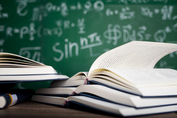 Studying books and learning materials.