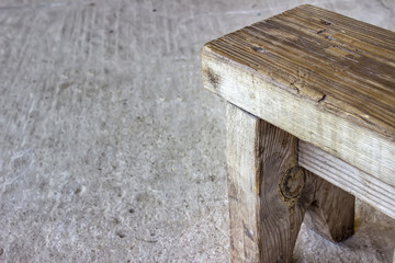 small old bench standing on concrete