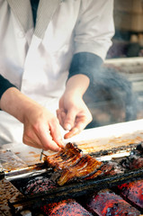 Grilling Unagi eel for Japanese Unagi donburi rice recipe - 203415060