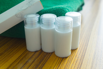 Set of cosmetics with green towel