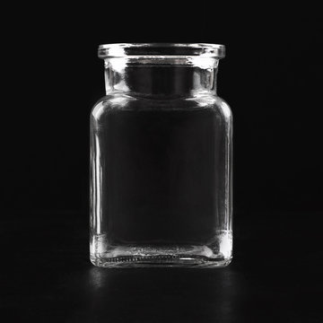 Transparent Glass Empty Jar On A Black Background