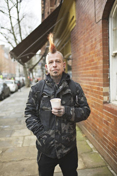 Portrait of a male punk with mohican hair