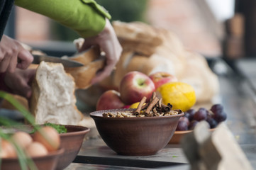 still life, ceramic bowl with nuts and cinnamon.