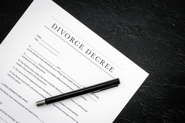 Divorce decree. Document on black backgroud top view space for text