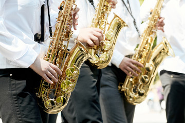 Obraz premium Closeup of children's brass band playing in the park.