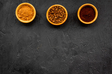 Ground seasoning for cooking desserts. Cinnamon, cocoa, coffee powder on black background top view copy space