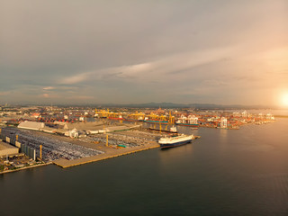 Aerial view a lot of car and ship port for import and export goods and container.