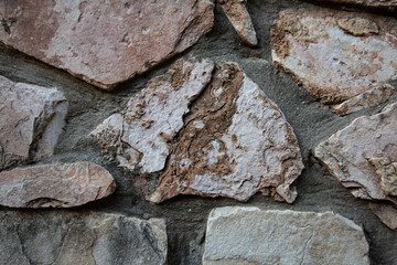 Close up of natural stone wall. Stone wall texture 