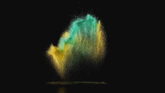 Colored powder/particles fly against black background. Shot with high speed camera, phantom flex 4K. Slow Motion.
