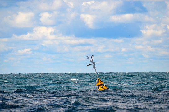 Floating Weather Station Buoy On Lake Michigan With Horizon Background