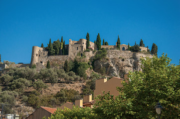 View of castle on top of a hill near the city center of Cassis, a beautiful and sunny seaside town with harbor. Located in the Bouches-du-Rhone department, Provence region, southeastern France