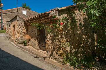 Fototapeta na wymiar View of house in alley with sunny blue sky, in the quiet and graceful village of Sillans-la-Cascade, on the way to Draguignan. Located in the Provence region, Var department, southeastern France