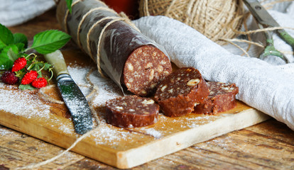 Chocolate salami with biscuits and hazelnuts 
