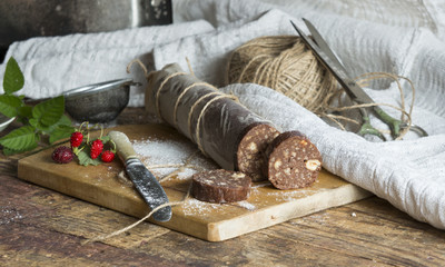 Chocolate salami with biscuits and hazelnuts 
