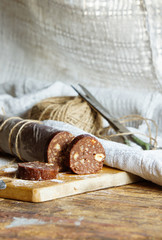 Chocolate salami with biscuits and hazelnuts 
