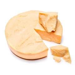 Whole round Head and pieces of parmesan or parmigiano